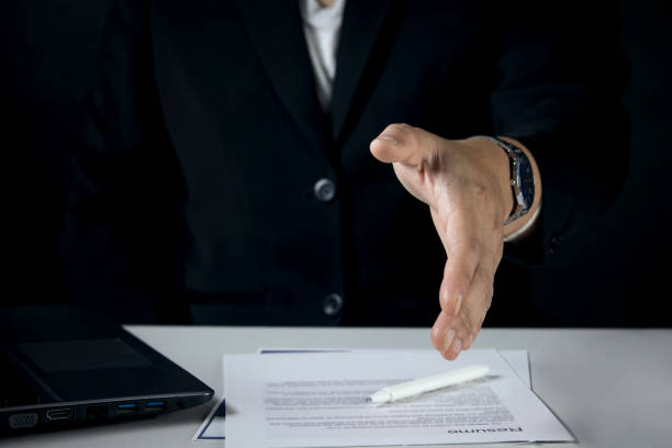 istock Two business men shaking hands after a job interview or agreement for cooperation. 1407819230
