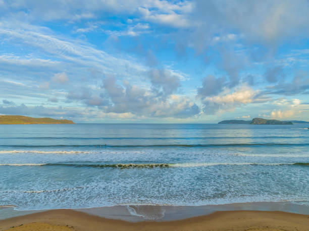 istock Aerial sunset at the seaside with rain clouds 1407820736