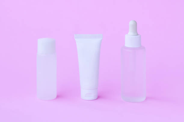 istock Cosmetic bottle on pink background 1407823418