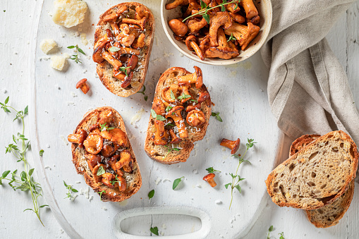 Vegetarian and crunchy toasts made of mushrooms and parmesan cheese. Crispy toasts with mushrooms and cheese.