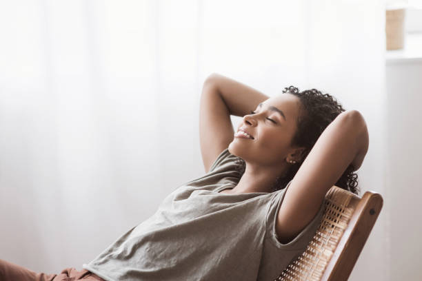 istock Young woman relaxing at home 1407824512
