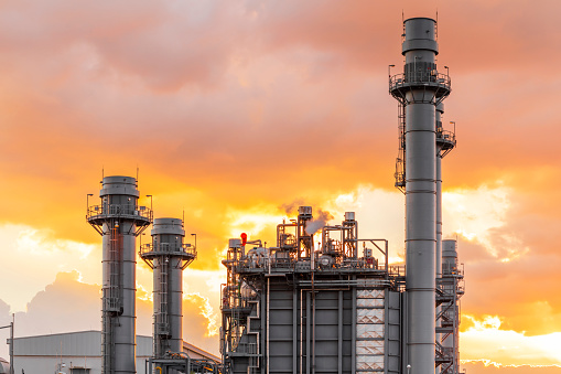 Industrial view at oil refinery plant form industry zone with sunset sky background.