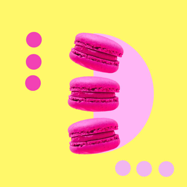 Three pink macaroons cookies float in the air. collage art. stock photo