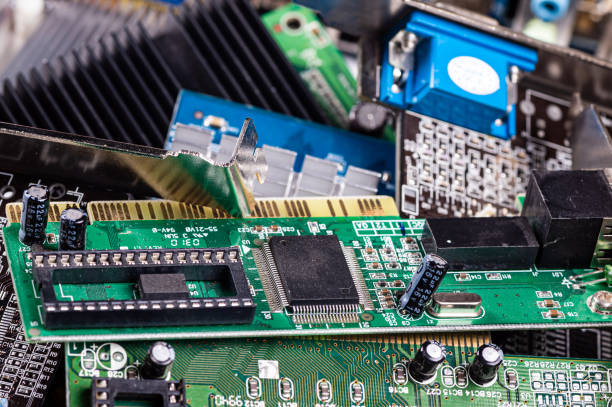 istock pile with various computer electrical boards and components, Repairing and upgrade concept, closeup 1407829925