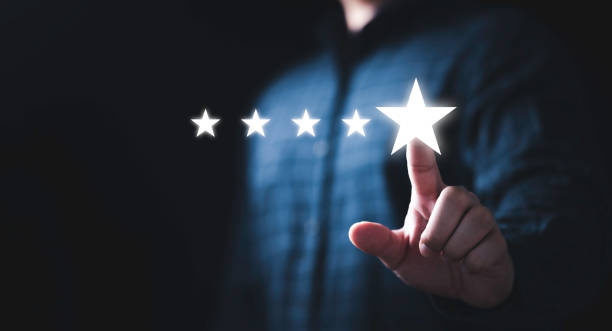 istock Businessman touching glowing five stars to excellent evaluate and customer satisfaction after use product and service concept. 1407830212