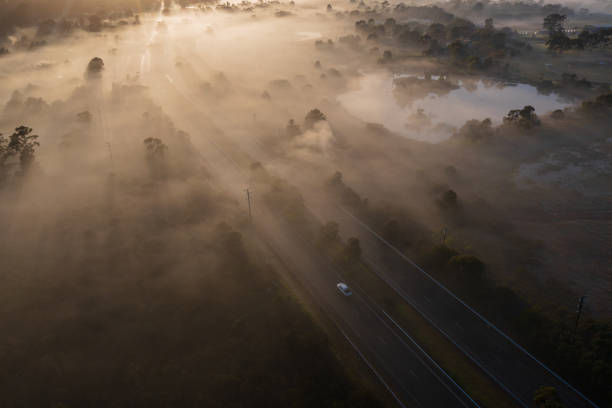 istock Aerial Fog Highway at Sunrise 1407830231