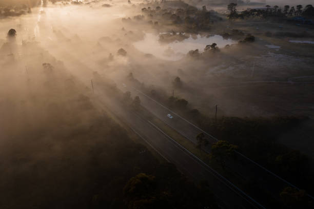 istock Aerial Fog Highway at Sunrise 1407830301