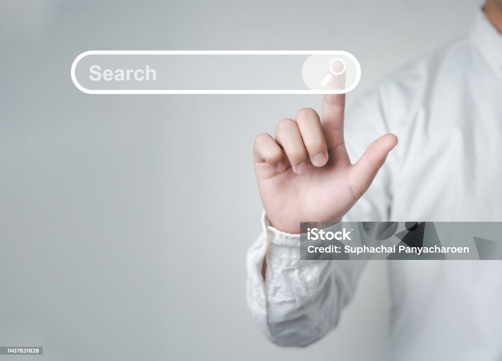 Man standing with hands pointing to information search is a data clicking to virtual internet search page computer touch screen Man standing with hands pointing to information search is a data clicking to virtual internet search page computer touch screen. Education, Knowledge, Analysis the Internet to connect wirelessly. Searching Stock Photo