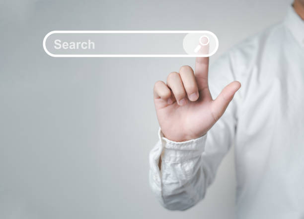 Man standing with hands pointing to information search is a data clicking to virtual internet search page computer touch screen Man standing with hands pointing to information search is a data clicking to virtual internet search page computer touch screen. Education, Knowledge, Analysis the Internet to connect wirelessly. searching stock pictures, royalty-free photos & images