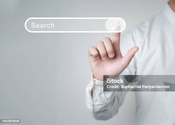 Man Standing With Hands Pointing To Information Search Is A Data Clicking To Virtual Internet Search Page Computer Touch Screen Stock Photo - Download Image Now