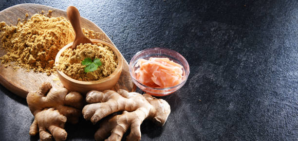 istock Bowls with marinated and ground ginger and its fresh rhizome 1407832119