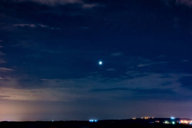 istock Milky Way stars with countryside landscape. 1407834665