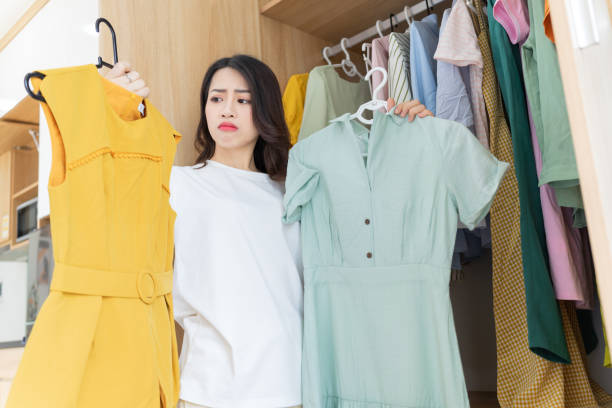 Young Asian woman trying on clothes
