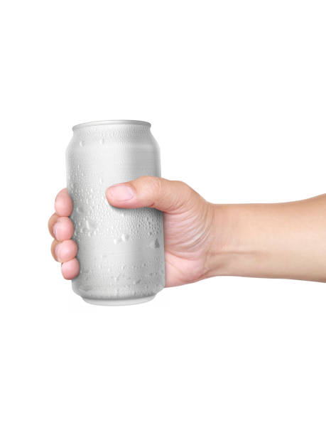 istock Man holding aluminum can with water droplets isolated on white background 1407834734