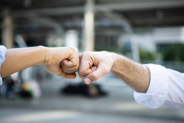 istock Success bumping their fists with colleagues. 1407835524