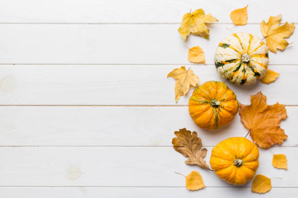 istock Autumn composition. Pattern made of dried leaves and other design accessories on table. Flat lay, top view 1407835619