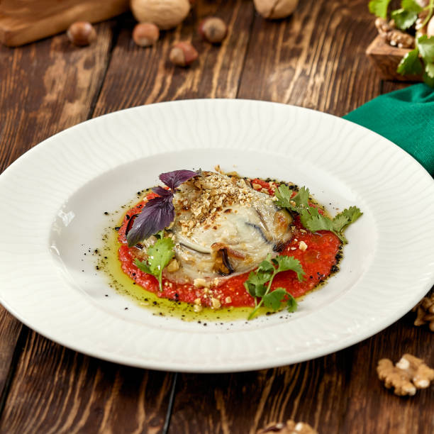 istock Hot appetizer - baked eggplant with cheese and tomatoes. Stuffed eggplants with mozzarella cheese and tomato sauce in rustic style. Eggplant and cheese appetizer on white plate in italian style. 1407836055