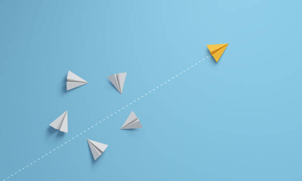 istock Individual and innovator leader paper airplane changing direction. Leadership concept. 1407838093