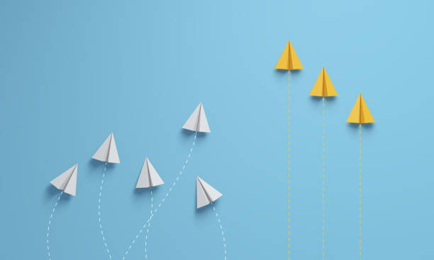 istock Paper planes organized as a team to improve processes. 1407838108