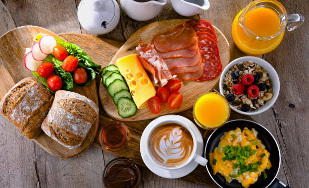 istock Breakfast served with coffee, scrambled eggs, cereals and ham 1407838616