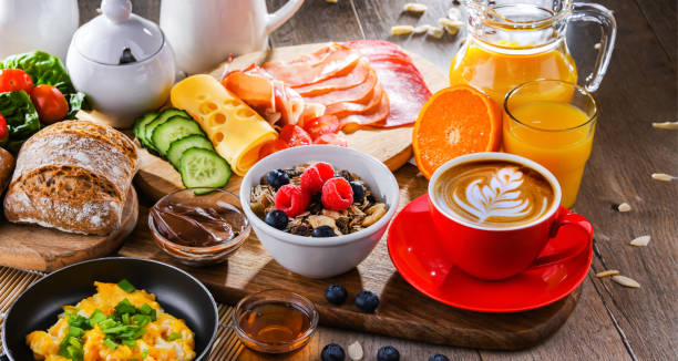 istock Breakfast served with coffee, scrambled eggs, cereals and ham 1407839170