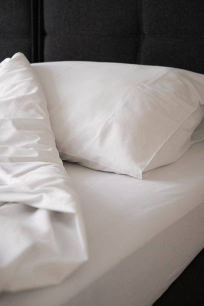istock cozy bedroom interior in scandinavian style. bed with white sheets 1407841485