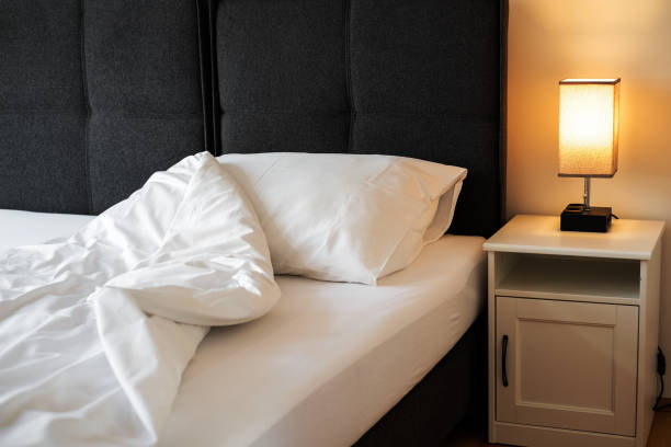 istock cozy bedroom interior in scandinavian style. bed with white sheets 1407841486