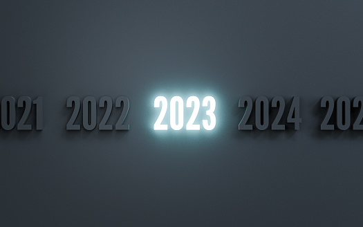 Glowing of 2023 year among normal number dark black background for preparation merry Christmas and happy new year concept by 3d render illustration.