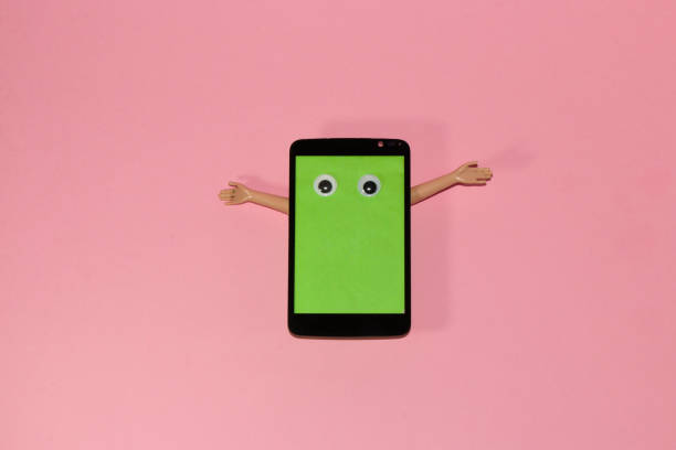 istock mobile phone with green screen as copy space wants to hug you, creative modern abstract techno wallpaper, pink background 1407842712