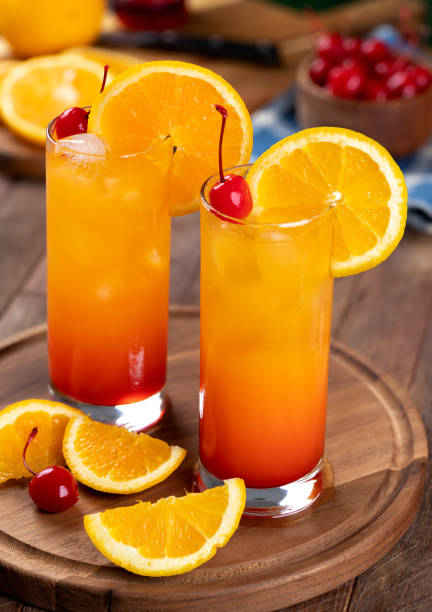 istock Tequila sunrise cocktail with orange slice and cherry 1407843467