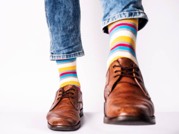 istock Men's legs, trendy shoes and bright socks 1407843593