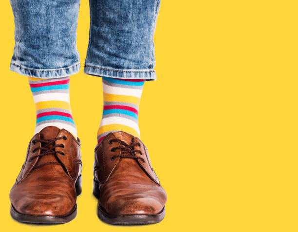 istock Men's legs, trendy shoes and bright socks 1407843608