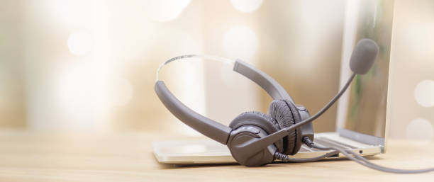 istock Headset and customer support equipment at call center service. 1407846344