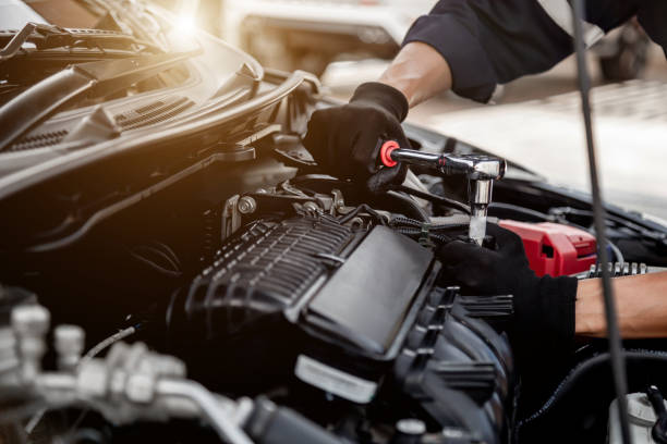 Car care maintenance and servicing, Close-up hand technician auto mechanic using the wrench to repairing change spare part car engine problem and insurance service support. Car care maintenance and servicing, Close-up hand technician auto mechanic using the wrench to repairing change spare part car engine problem and insurance service support. auto repair shop stock pictures, royalty-free photos & images