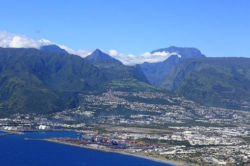 Reunion island city of Saint Denis and Le Port with mountain landscape