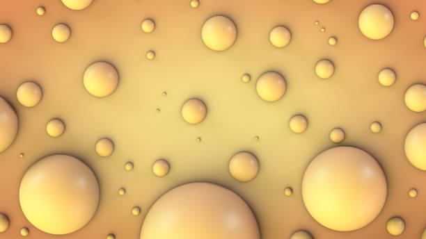 istock Spherical yellow particles of different diameters on an orange surface 1407848719