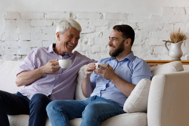 istock Happy senior dad and 35s son drink coffee enjoy conversation 1407852729