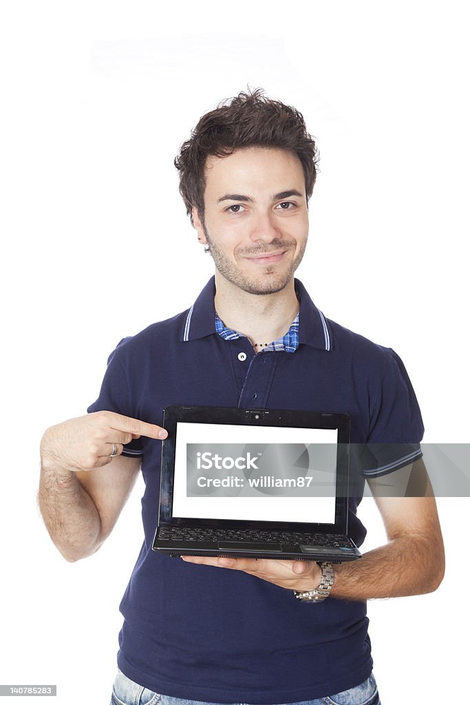 Giovane uomo che tiene un Computer con schermo vuoto - Foto stock royalty-free di Adulto
