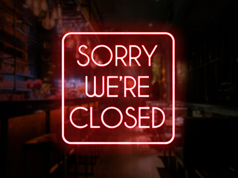 Closed neon sign of a bar or pub. Concept of closing time of a bar, restobar or pub.