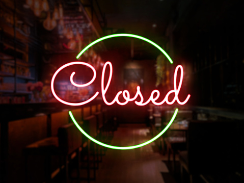 Closed neon sign of a bar or pub. Concept of closing time of a bar, restobar or pub.