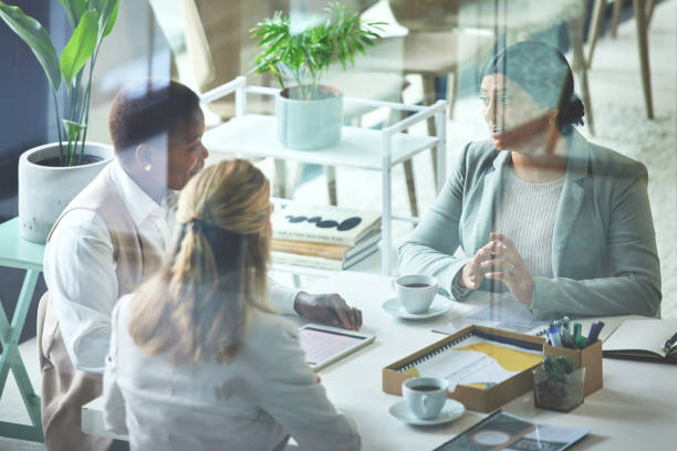 istock Diverse group of corporate executives brainstorming ideas, planning solution and success strategy. Powerful women in business united. Team of businesswomen meeting and talking in office boardroom. 1407854320