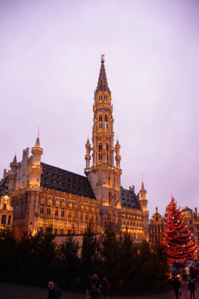 Hotel de Ville, or town hall, illuminated at sunset at Christmas. Brussels, Belgium, Europe.