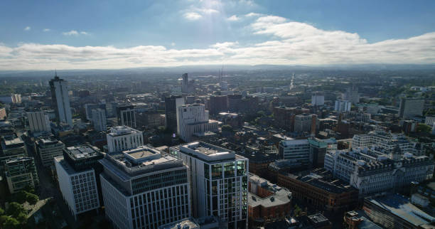 istock Manchester City Centre Drone Aerial View Above Building Work Skyline Construction Blue Sky Summer 2022 1407855261