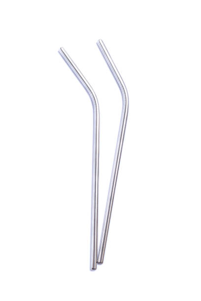 Reusable stainless steel straws isolated on a white, vertical, top stock photo