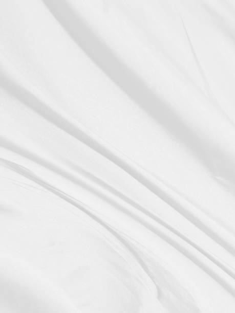 istock fashion textile Clean woven beautiful soft fabric abstract smooth curve shape decorative white background 1407858215