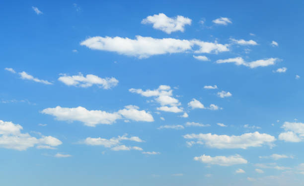 istock beautiful blue sky with clouds on bright sunny day for abstract background 1407859197