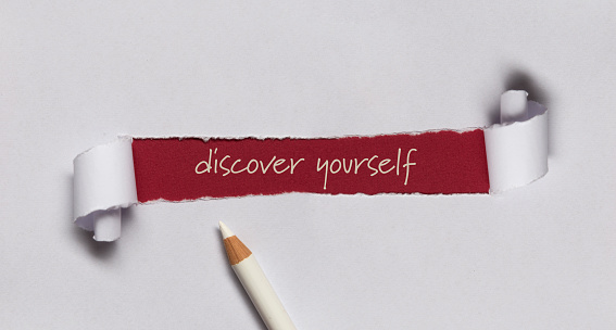 Discover yourself written under torn paper.