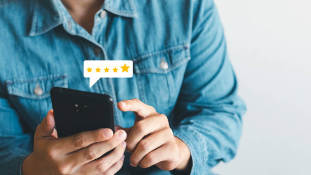 istock User give rating to service experience on online application, Customer review satisfaction feedback survey concept, Customer can evaluate quality of service leading to reputation ranking of business. 1407860895