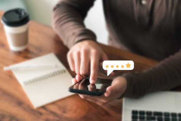 istock User give rating to service experience on online application, Customer review satisfaction feedback survey concept, Customer can evaluate quality of service leading to reputation ranking of business. 1407861782