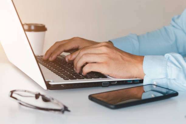 istock businessmen working at their desks with notebooks taking notes Accepting orders from online customers, online business and e-commerce, Online stores selling products. 1407863135